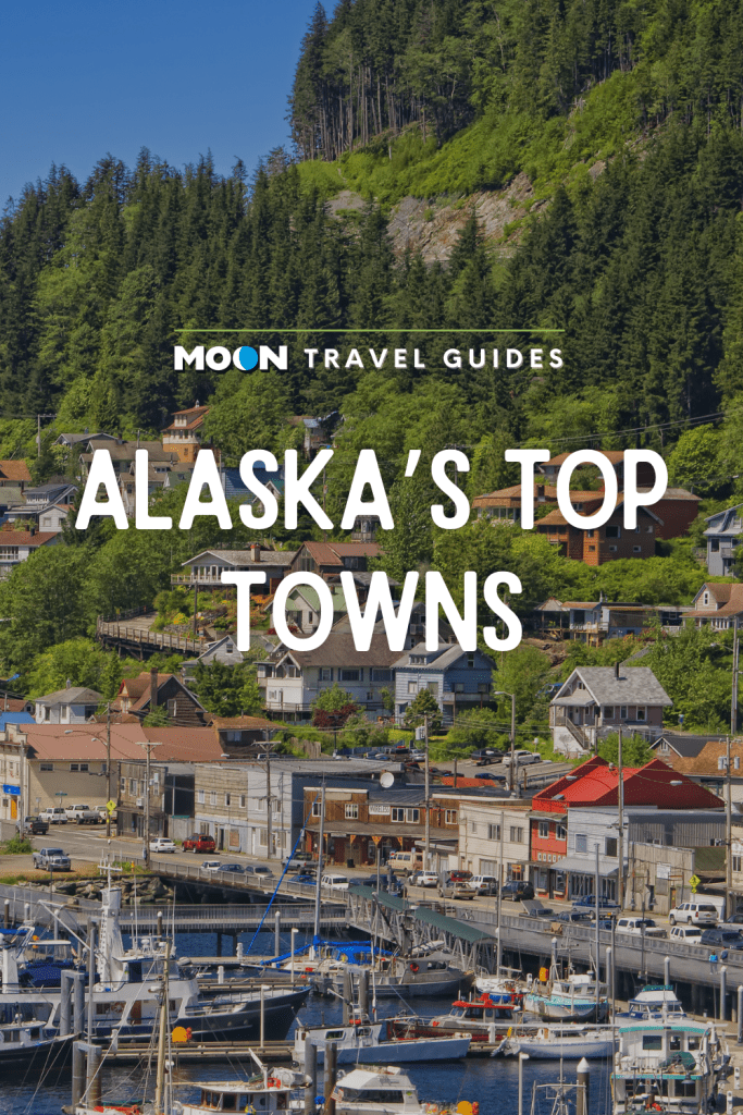 Image of town and boat harbor with text Alaska's Top Towns