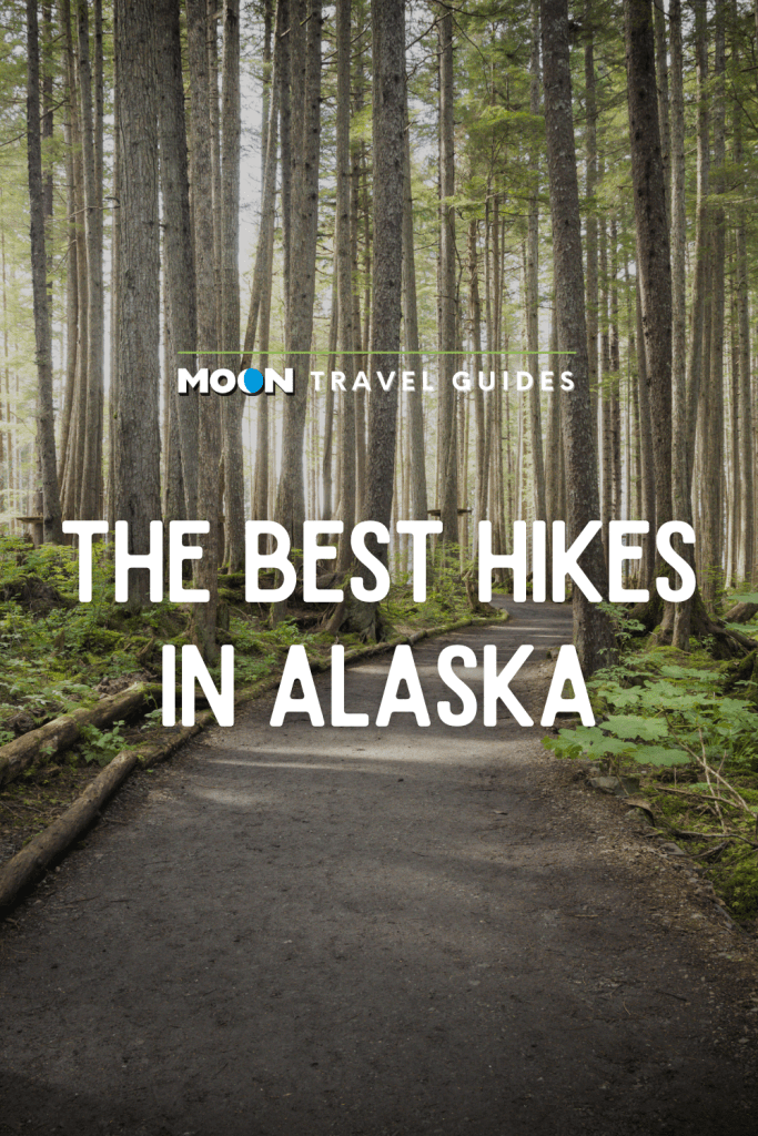 Image of flat trail leading through forest with text The Best Hikes in Alaska