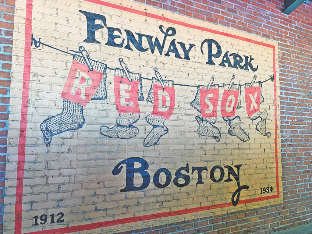 Fenway Park Red Sox sign painted on a brick wall