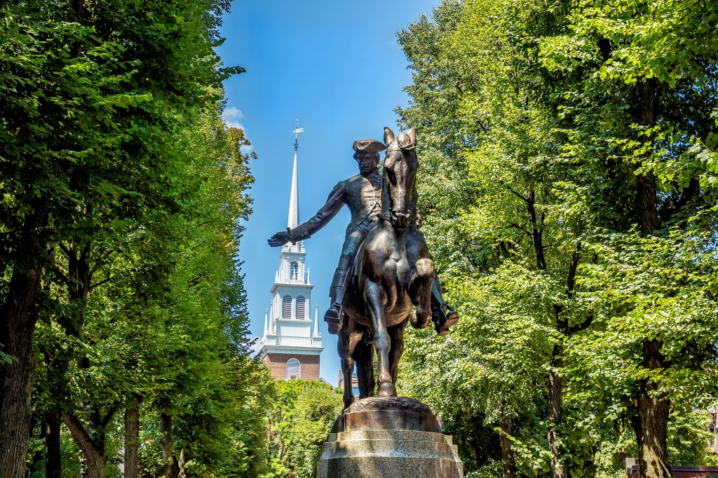 A statue of Paul Revere in front of the Old North Church