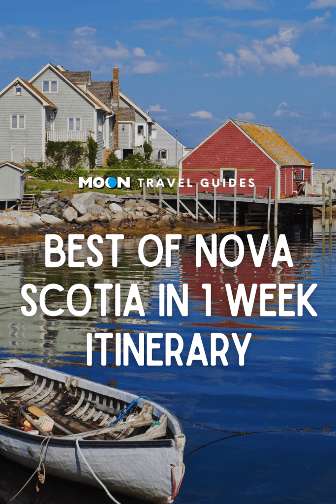 Image of boat in a tranquil cove with text Best of Nova Scotia in 1 Week Itinerary