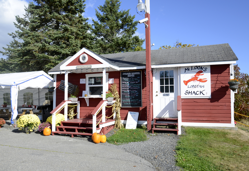 Image of charming red building trimmed with white with a sign depicting a red lobster