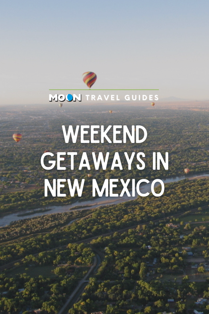 Image of hot air balloons over green landscape with text weekend getaways in New Mexico