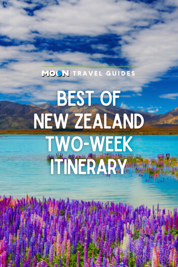 Turquoise lake ringed with purple flowers and text Best of New Zealand Two-Week Itinerary