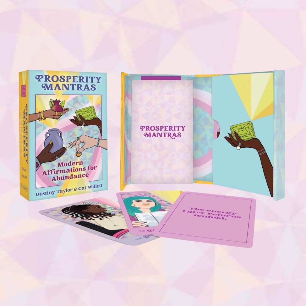 Image of the “Prosperity Mantras” box, guidebook, and several cards from the deck