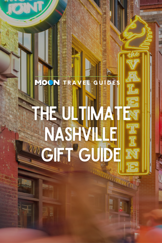 Image of neon signs on brick buildings and text The Ultimate Nashville Gift Guide