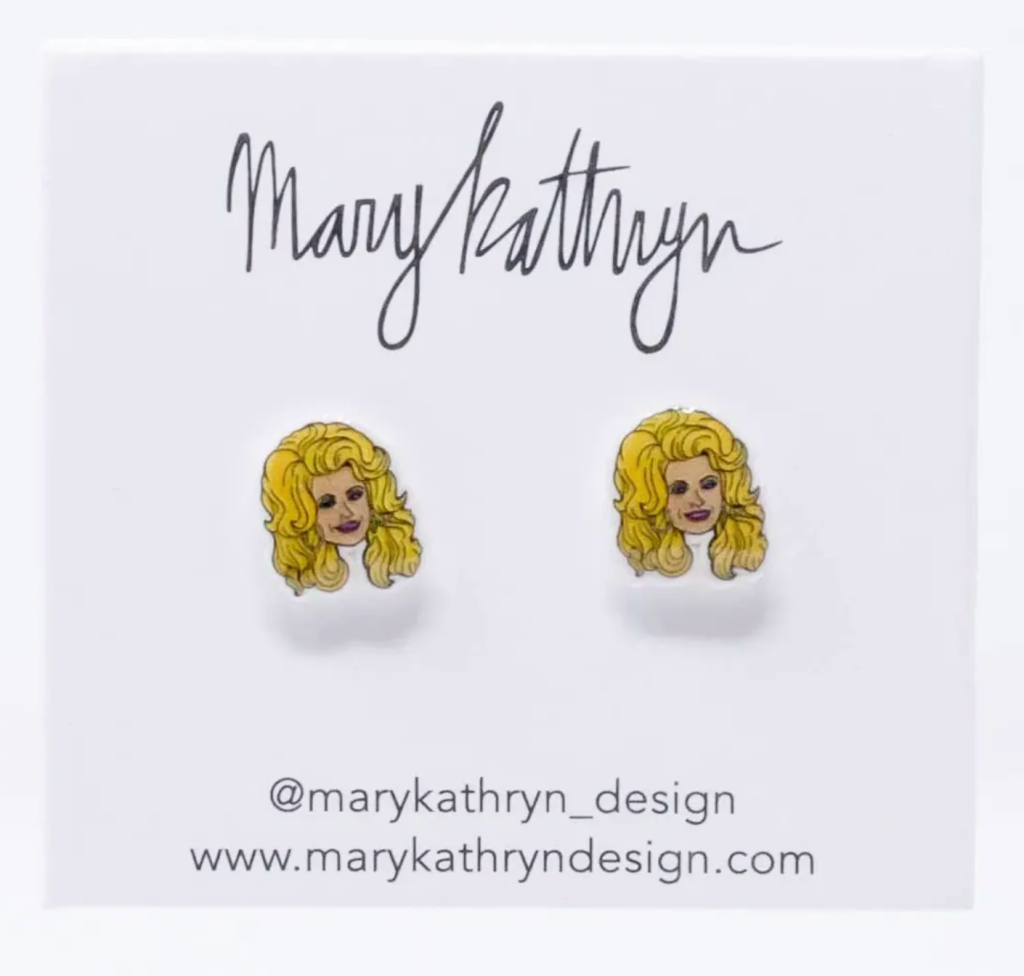 Image of two small earrings of Dolly Parton's face